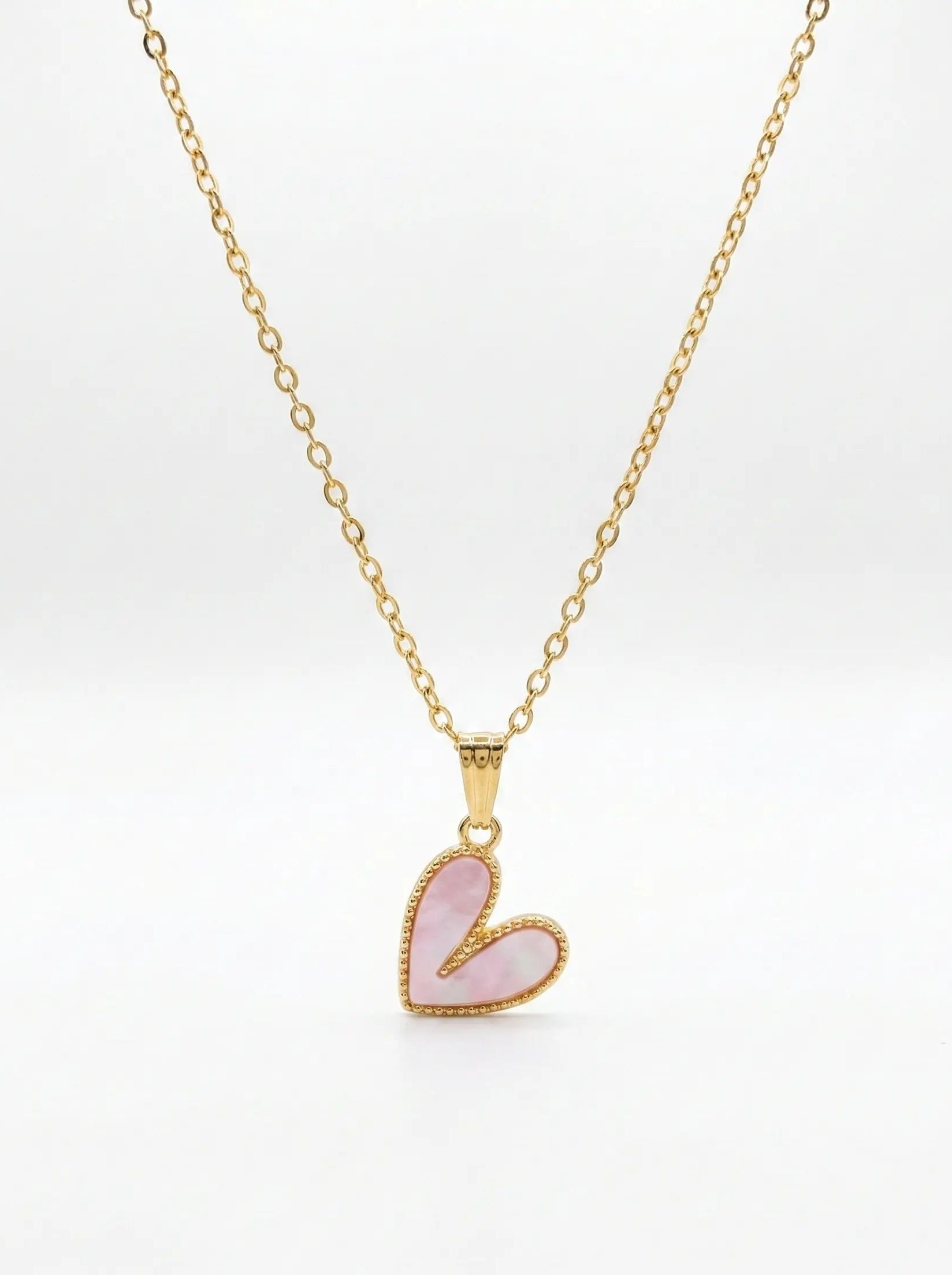Necklace with a pink heart pendant on a white background