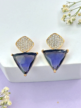 A pair of Aria purple triangle and teardrop CZ dangle earrings in a gold-tone setting on a white background