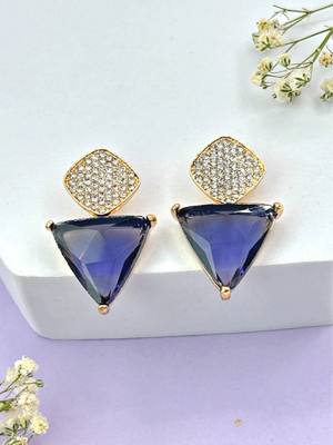 A pair of Aria purple triangle and teardrop CZ dangle earrings in a gold-tone setting on a white background